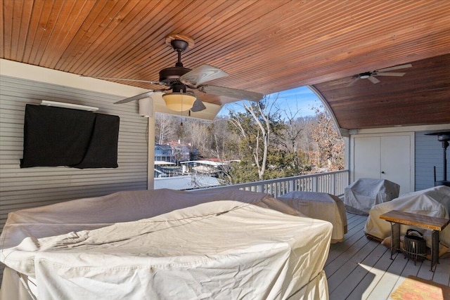 deck with ceiling fan and area for grilling