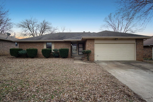 ranch-style home featuring a garage