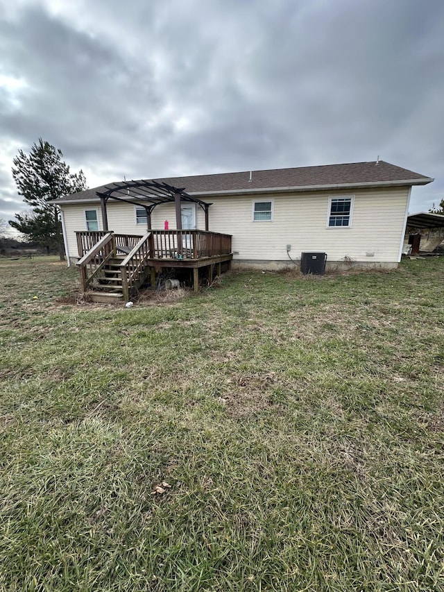 back of house with cooling unit, a pergola, a deck, and a yard