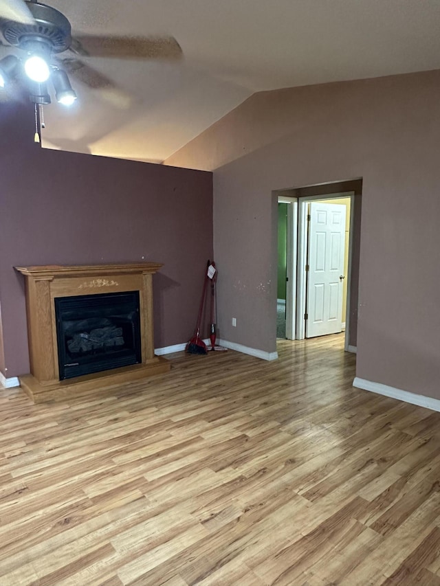 unfurnished living room featuring ceiling fan, light hardwood / wood-style flooring, and lofted ceiling