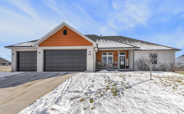 ranch-style home with a garage and a porch