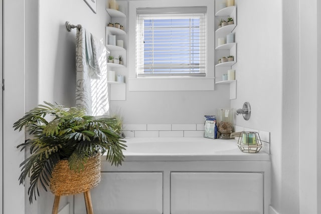 bathroom with a tub