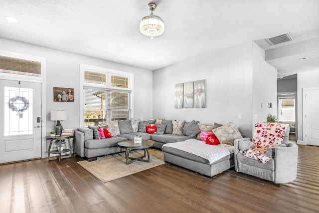 living room featuring dark wood-type flooring