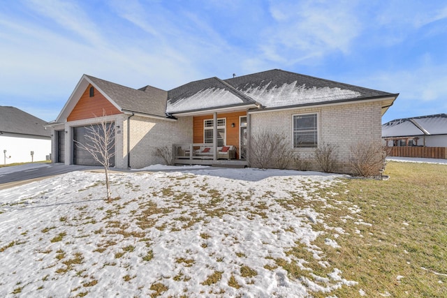 view of front of house featuring a garage and a porch