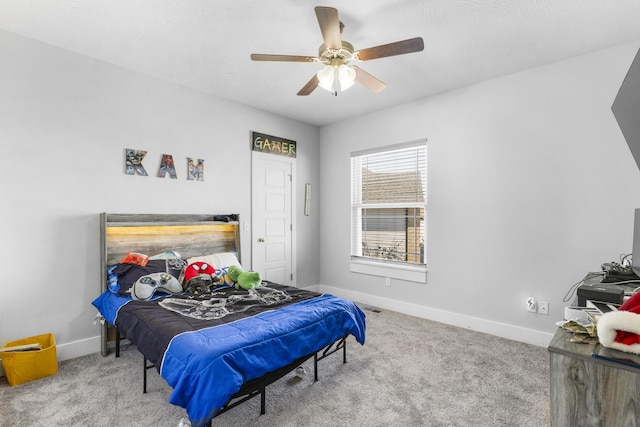 carpeted bedroom featuring ceiling fan