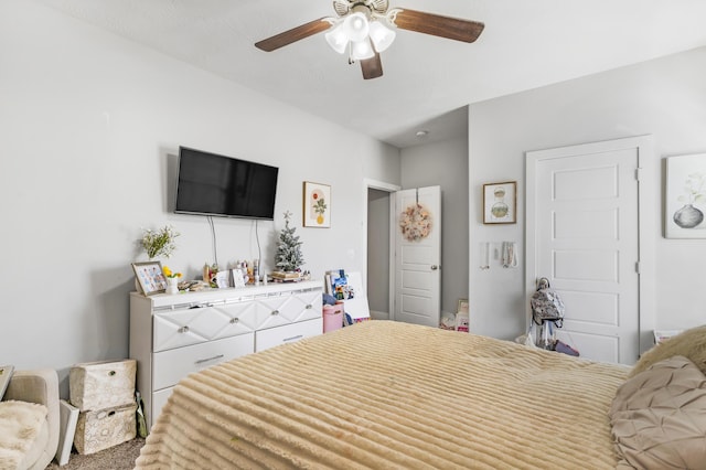 bedroom with ceiling fan and carpet flooring