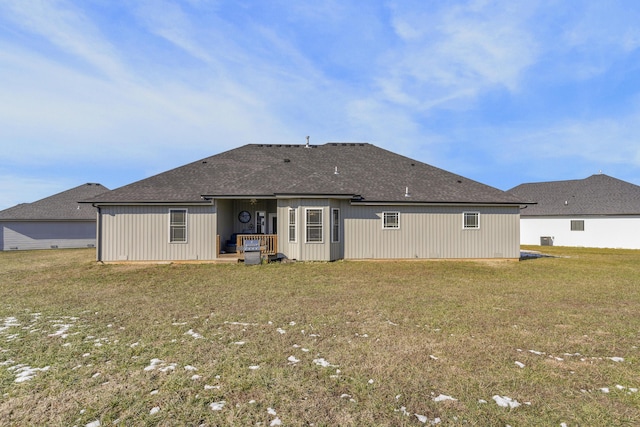 rear view of house with a lawn