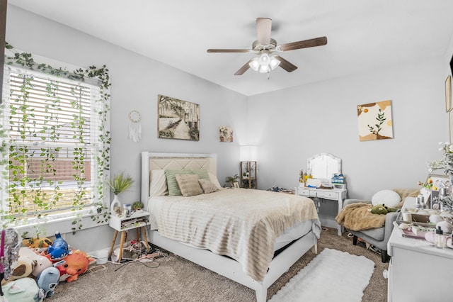 bedroom with ceiling fan and carpet