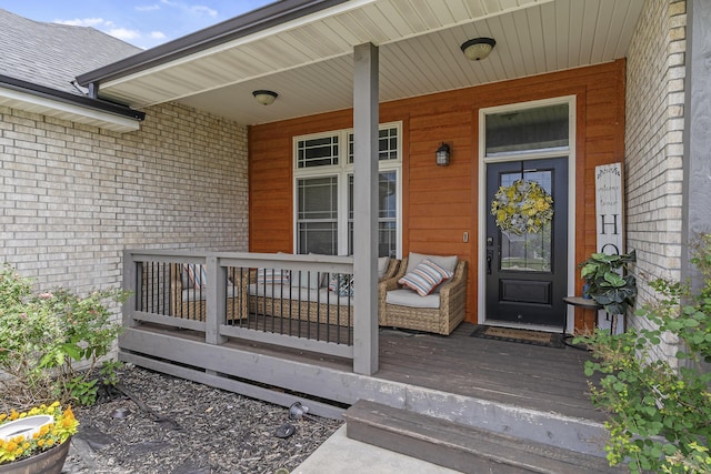 1360 N Rainbow Ct, Nixa, MO 65714 - doorway to property featuring covered porch and brick siding