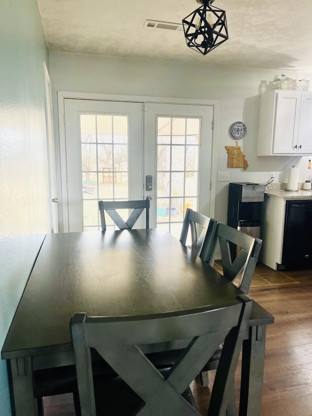 dining space featuring wood-type flooring