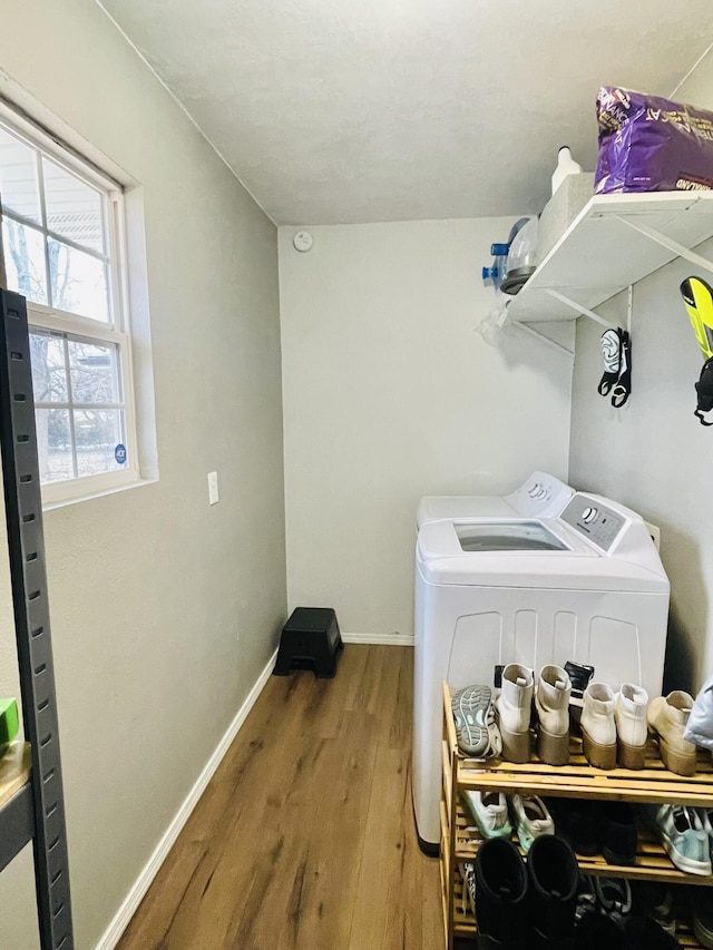 washroom featuring washer and dryer and hardwood / wood-style floors