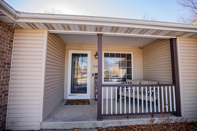 doorway to property featuring covered porch