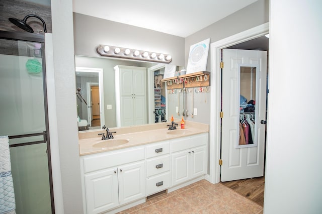 bathroom featuring tile patterned floors and vanity