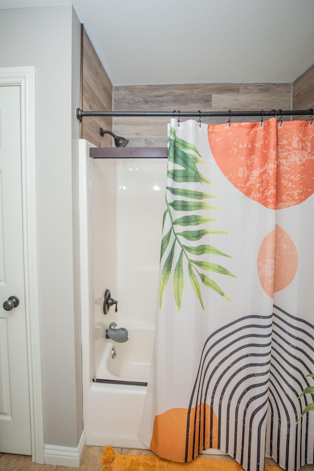 bathroom featuring tile patterned floors and shower / tub combo