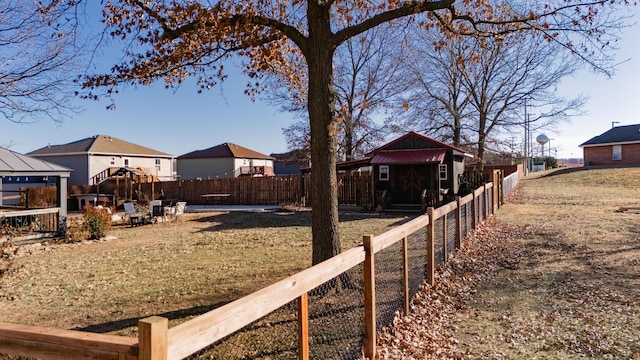 view of yard featuring a gazebo and a storage unit