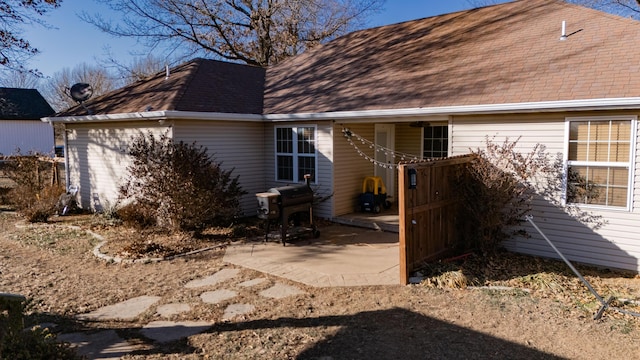 rear view of property featuring a patio