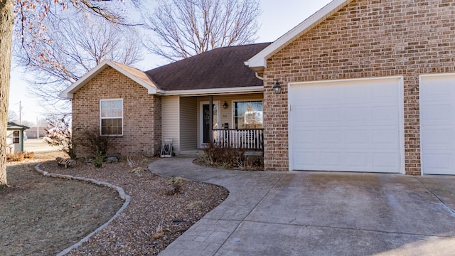 single story home featuring a garage and covered porch