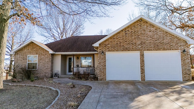 single story home with a porch and a garage