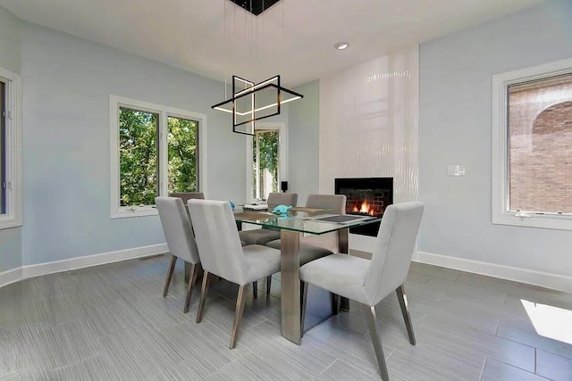 dining area featuring a large fireplace