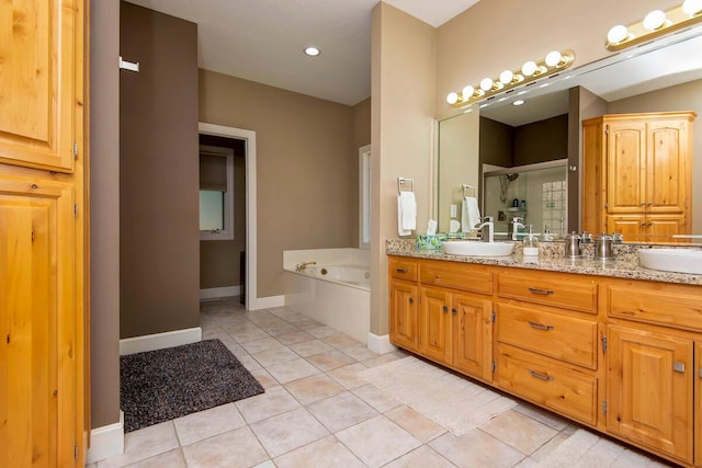 bathroom featuring separate shower and tub, vanity, and tile patterned flooring