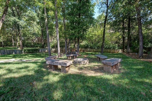 view of yard featuring an outdoor fire pit