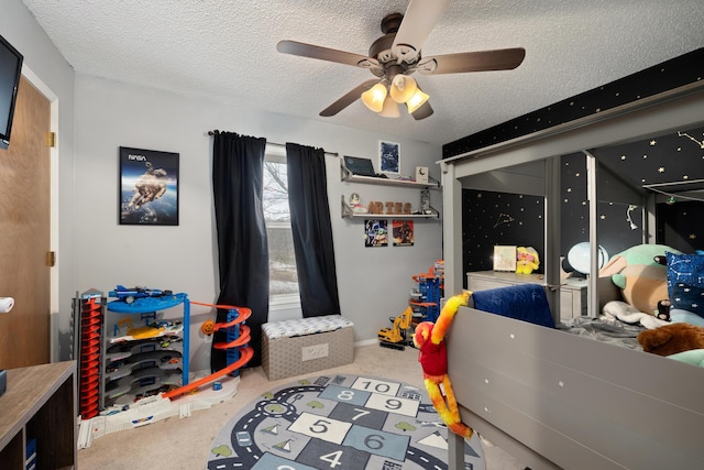 carpeted bedroom featuring a textured ceiling and ceiling fan