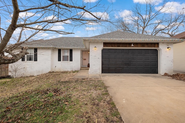 ranch-style home featuring a garage