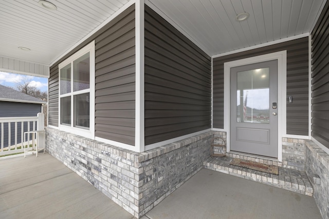 property entrance with covered porch