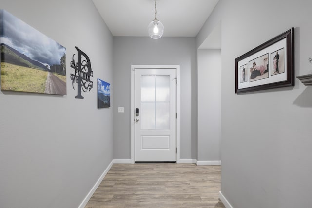 entryway with light hardwood / wood-style floors