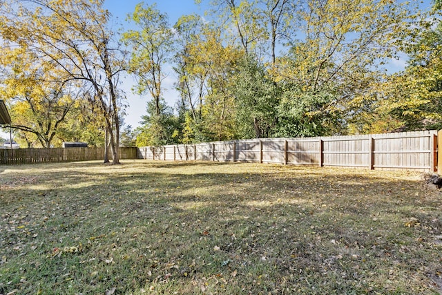 view of yard with a fenced backyard