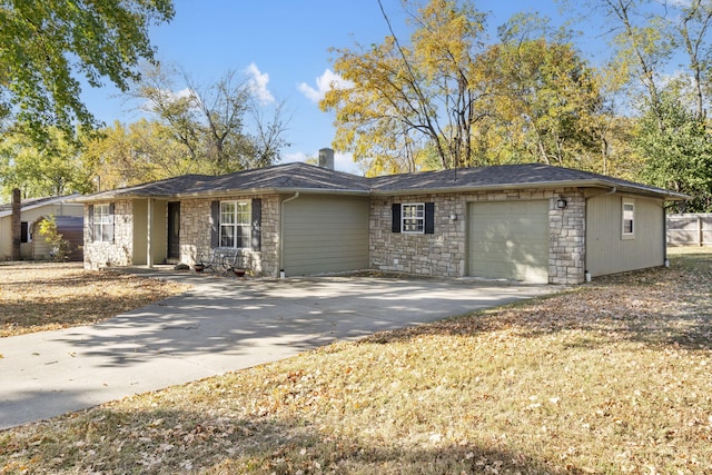 ranch-style house with concrete driveway, stone siding, an attached garage, and a shingled roof