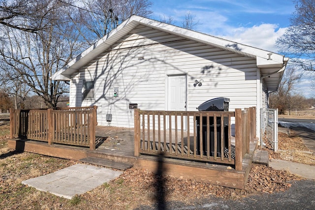 view of side of home featuring a deck