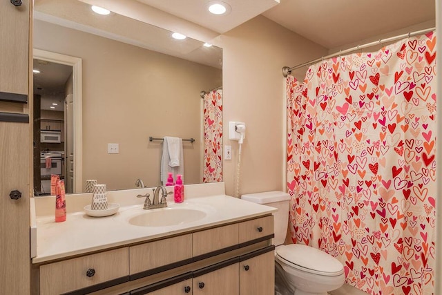 bathroom with vanity and toilet