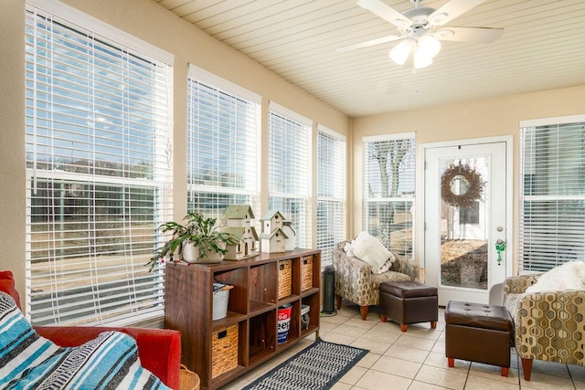 sunroom / solarium featuring ceiling fan