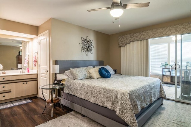 bedroom with sink, dark hardwood / wood-style floors, ceiling fan, and ensuite bathroom