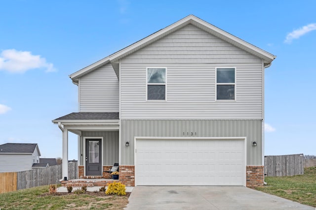 view of front of house featuring a garage and a porch