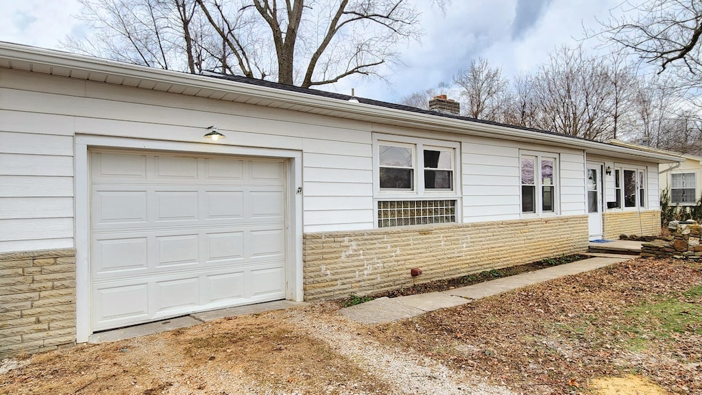 single story home featuring a garage