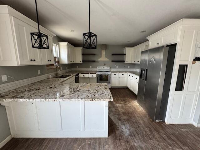 kitchen with pendant lighting, white electric range oven, wall chimney exhaust hood, stainless steel fridge with ice dispenser, and kitchen peninsula