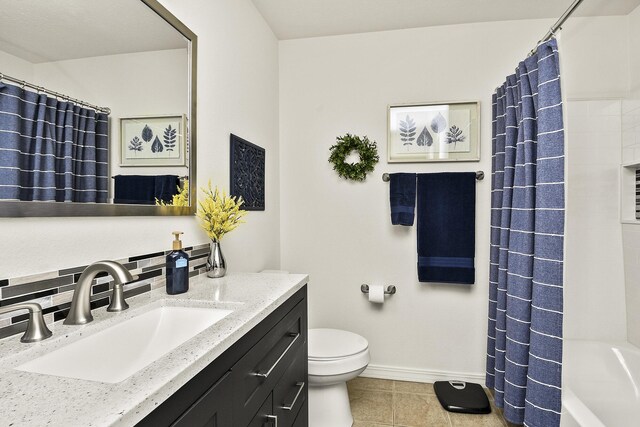 full bathroom featuring toilet, tasteful backsplash, tile patterned flooring, shower / bathtub combination with curtain, and vanity