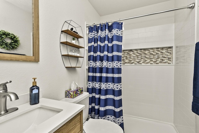 full bathroom with toilet, vanity, and shower / bath combo with shower curtain