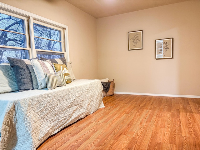 bedroom with light wood-type flooring