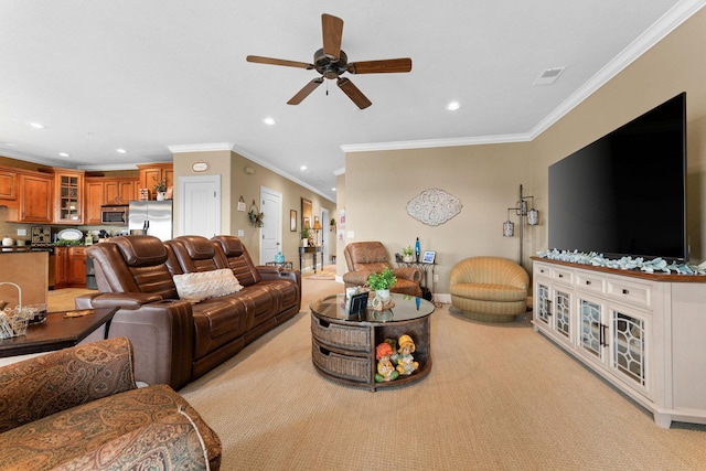 living room with light carpet, ceiling fan, and crown molding