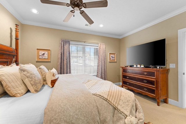 carpeted bedroom with ceiling fan and ornamental molding