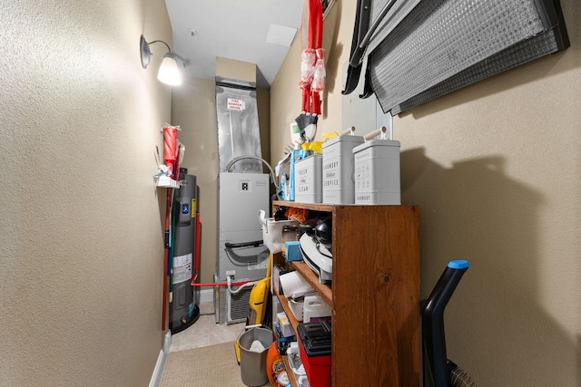 utility room featuring electric water heater