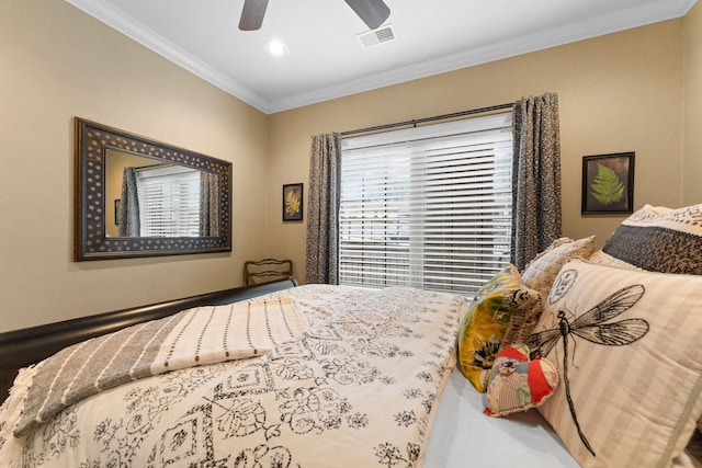 bedroom featuring ceiling fan and crown molding