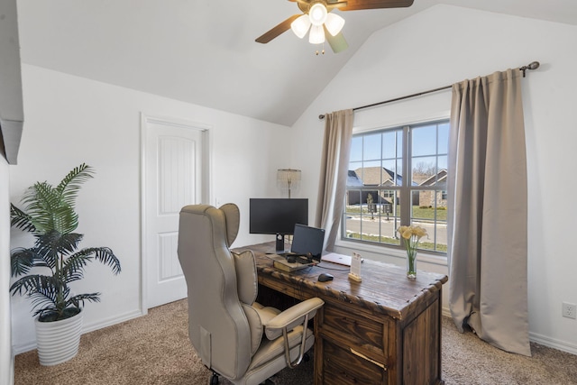 carpeted office space with ceiling fan and vaulted ceiling