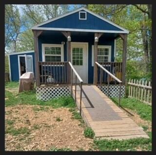 389 Osage Ln, Pineville, MO 64856 - exterior space featuring fence and a porch