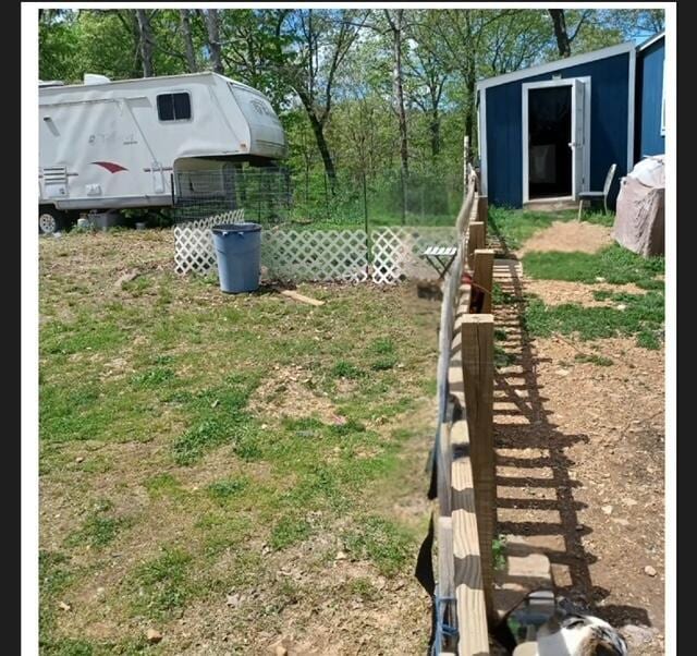 389 Osage Ln, Pineville, MO 64856 - view of yard with a storage shed, fence, and an outdoor structure
