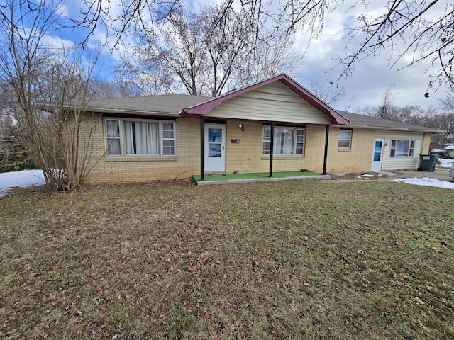 ranch-style home with a front yard