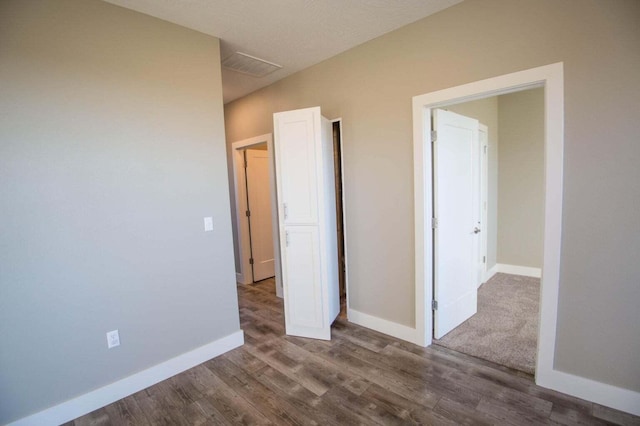 unfurnished bedroom featuring wood-type flooring